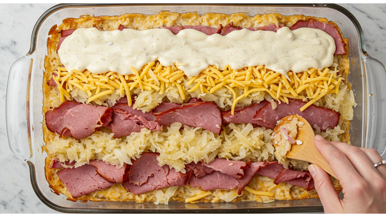 Reuben bake layers being repeated in a baking dish