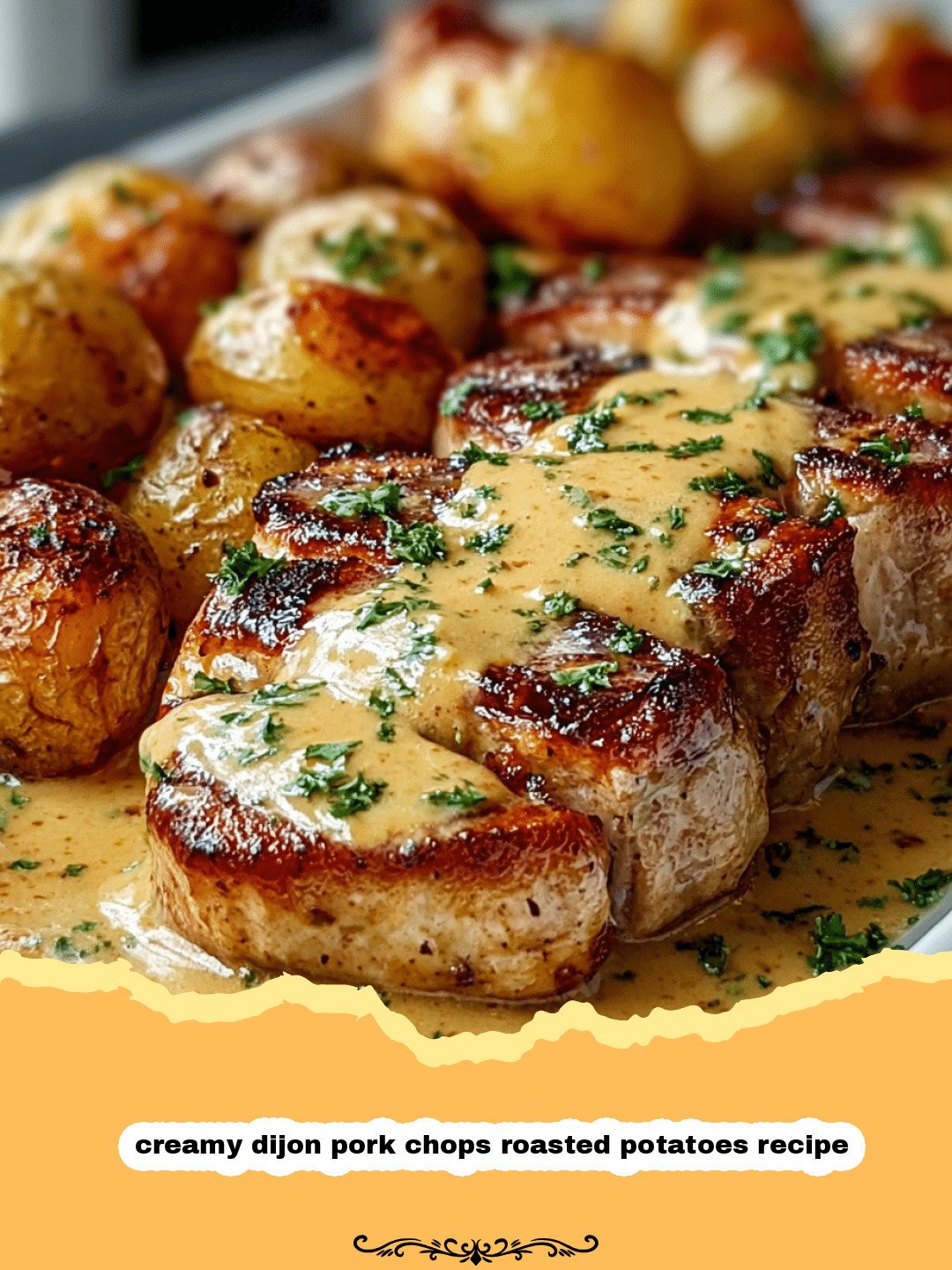 Plate of creamy dijon pork chops with roasted potatoes and a side of green beans.