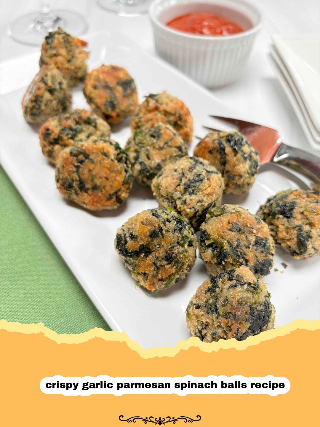 Close-up of golden brown crispy garlic parmesan spinach balls on a baking sheet, with some fresh parsley for garnish.