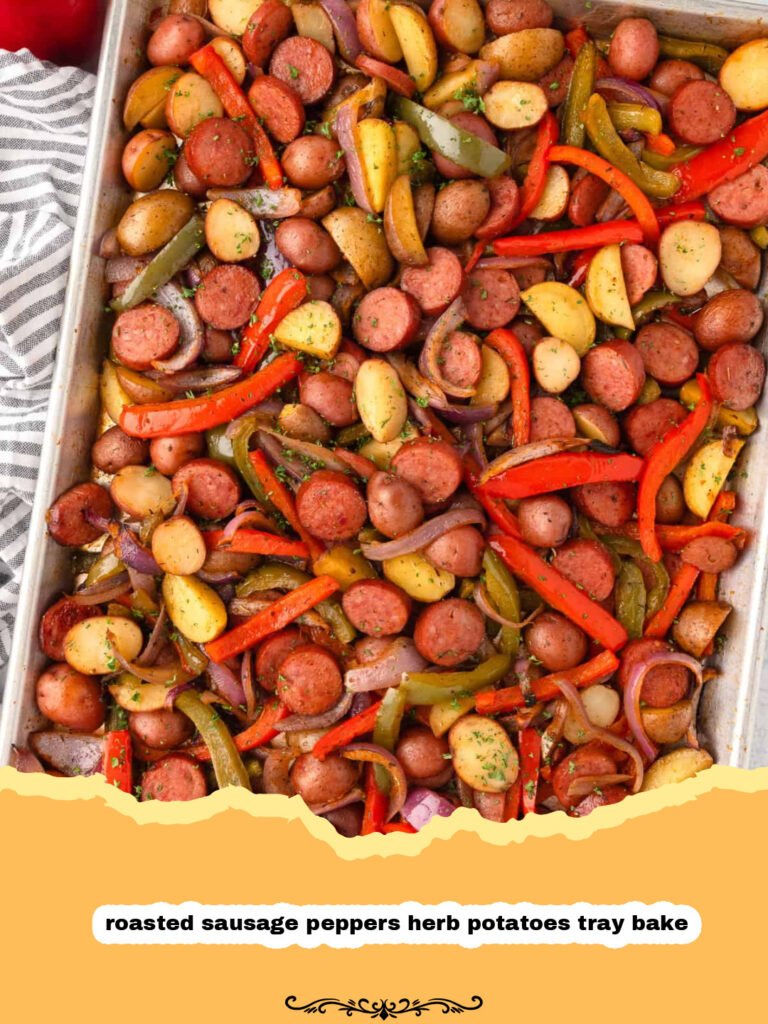 A vibrant sheet pan full of roasted Italian sausage, bell peppers, onions, and herb potatoes, cooked to golden perfection, ready to be served as a delicious roasted sausage peppers herb potatoes tray bake.