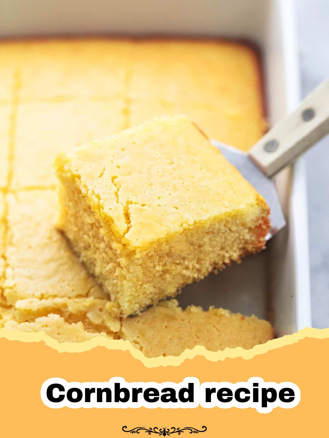 A perfectly golden brown square of classic cornbread with a crispy crust, sliced and ready to serve.