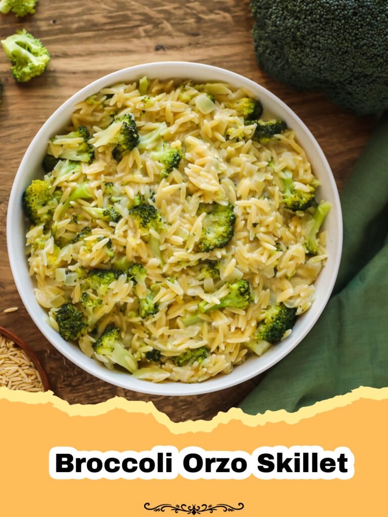 Close-up of a creamy broccoli orzo skillet with melted Parmesan cheese and fresh parsley, ready to be served.