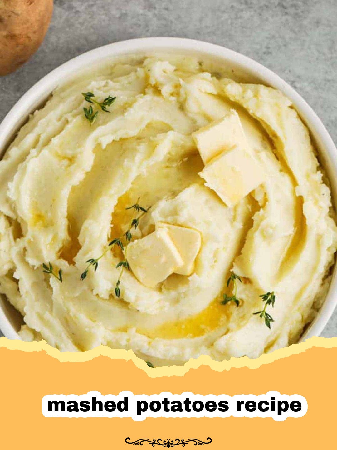 A creamy bowl of homemade mashed potatoes garnished with fresh chives and a swirl of butter.