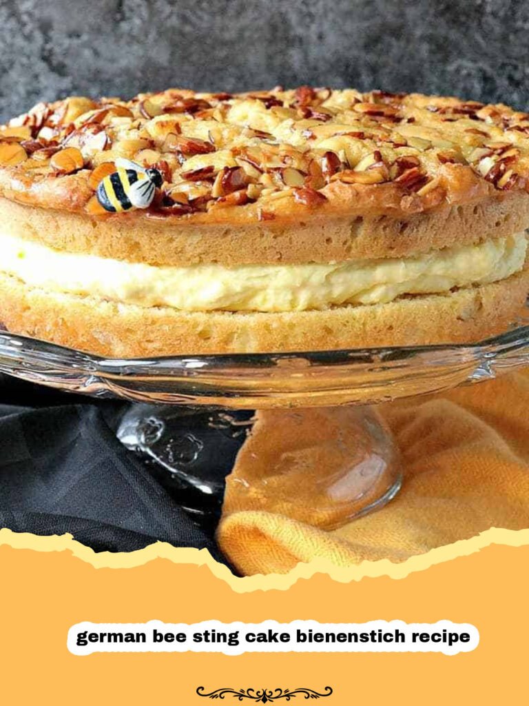 A glorious slice of German Bee Sting Cake (Bienenstich) with visible layers of light yeast cake, creamy vanilla custard, and a crunchy honey-almond topping.