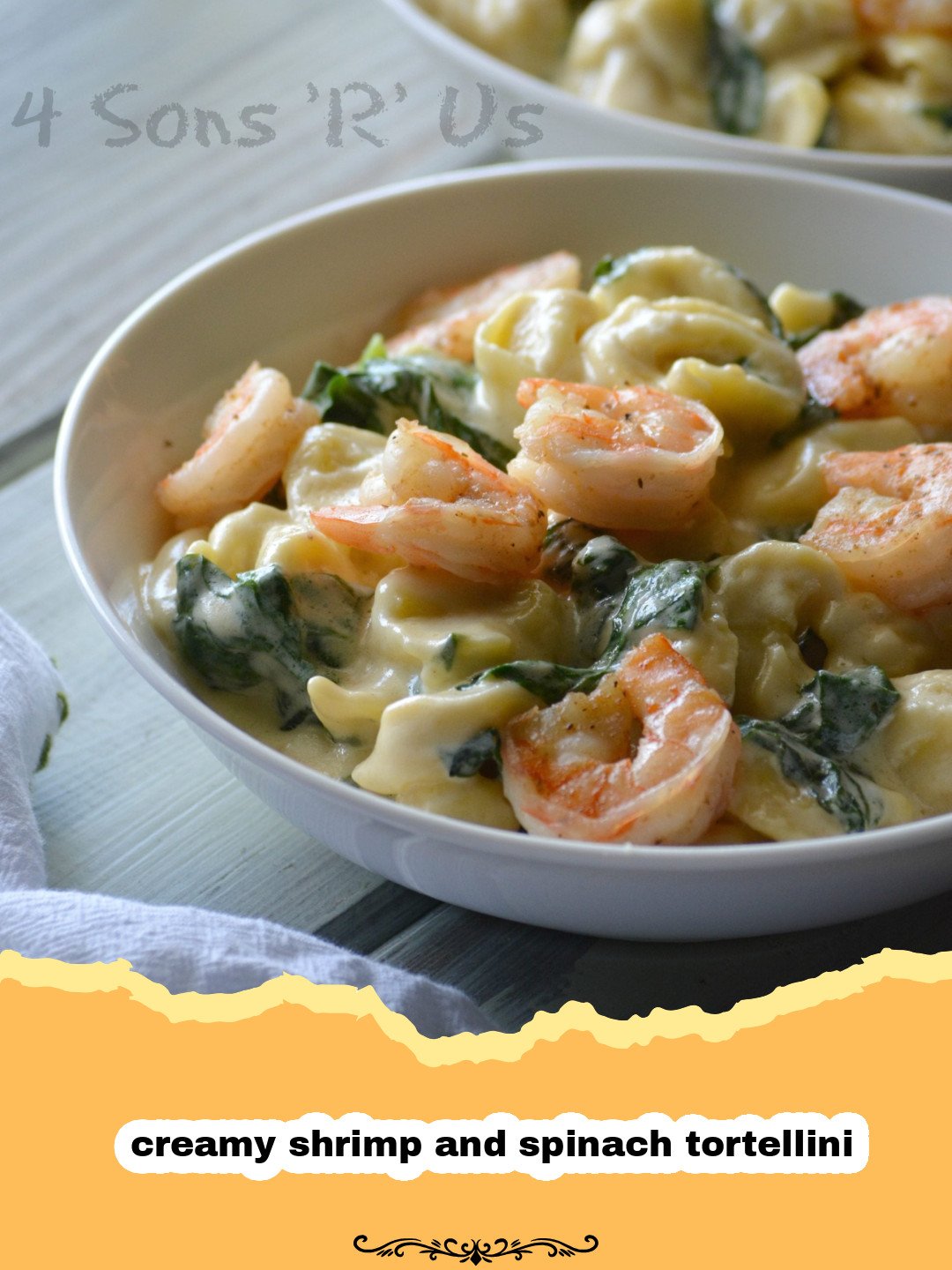 The Ultimate Creamy Shrimp and Spinach Tortellini: A Weeknight Dream! 3 A close-up of a bowl of creamy shrimp and spinach tortellini, garnished with fresh parsley and Parmesan cheese.