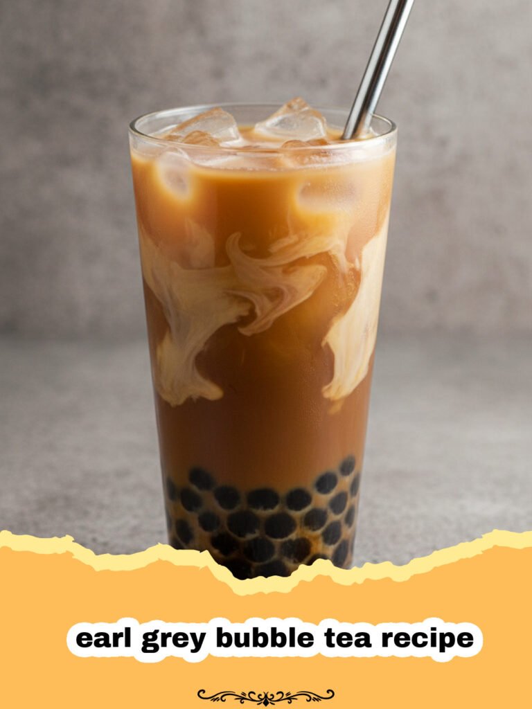 earl grey bubble tea recipe - A glass of creamy Earl Grey bubble tea with black tapioca pearls at the bottom and ice cubes.
