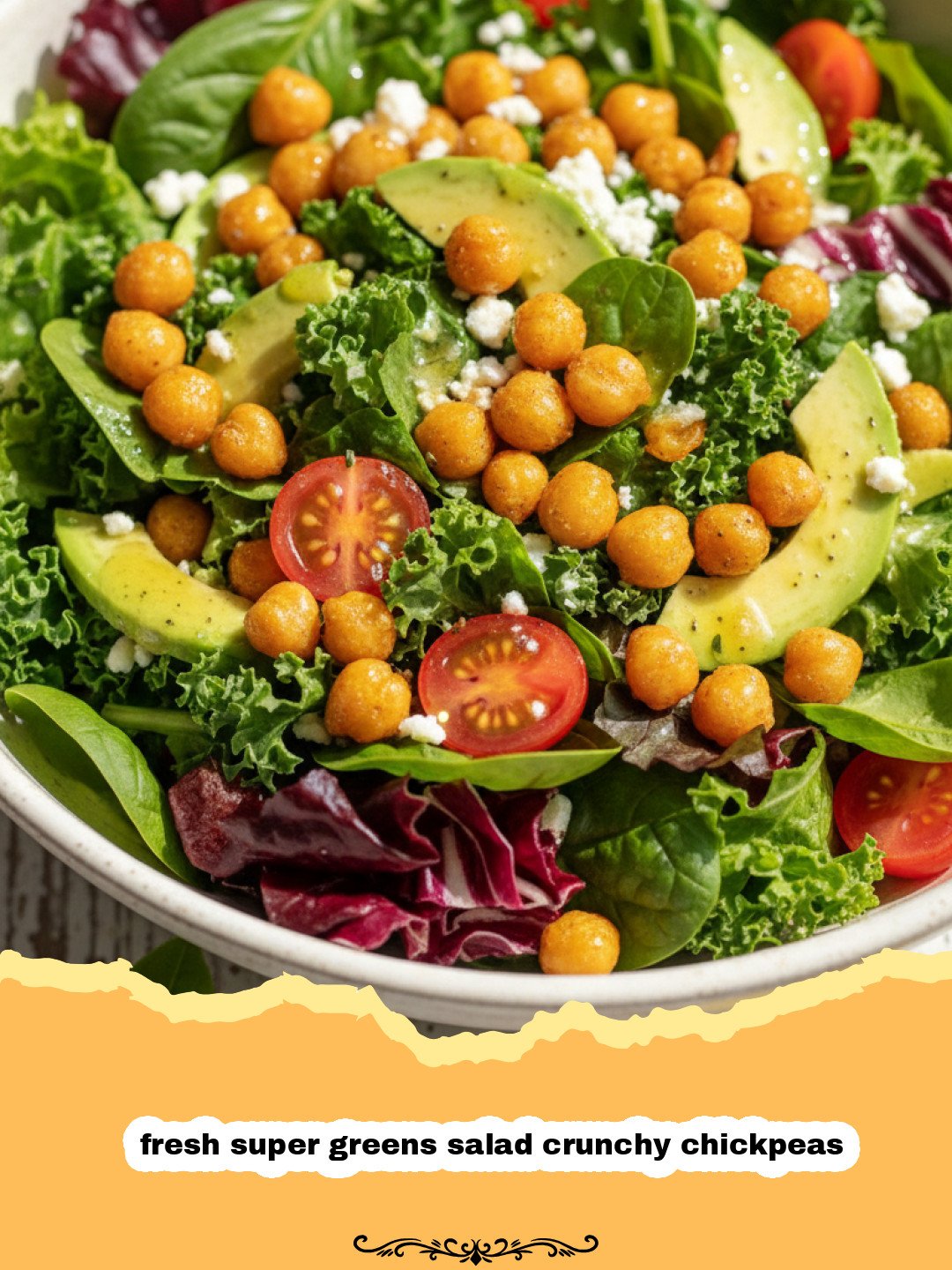 The Ultimate Fresh Super Greens Salad with Crunchy Chickpeas & Zesty Dressing 3 A vibrant fresh super greens salad with crispy roasted chickpeas, cherry tomatoes, cucumber, and red onion, drizzled with a creamy tahini dressing, on a light background.