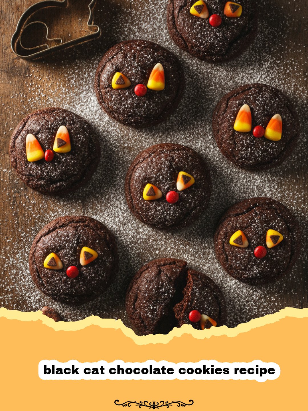 black cat chocolate cookies recipe - A tray of dark black cat chocolate cookies with white whiskers and green candy eyes.