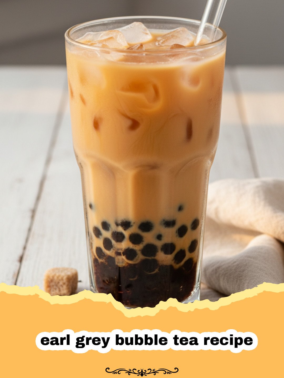 earl grey bubble tea recipe - A tall glass of Earl Grey bubble tea with dark pearls at the bottom and a creamy tea layer on top.