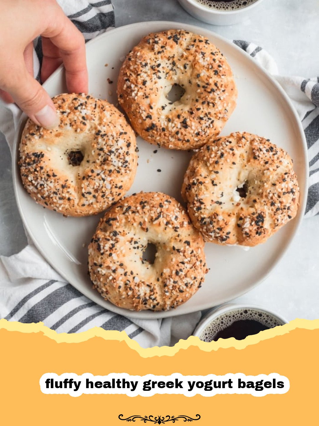 The Secret to Incredible Fluffy Healthy Greek Yogurt Bagels 3 Freshly baked fluffy healthy Greek yogurt bagels topped with everything bagel seasoning on a cooling rack.