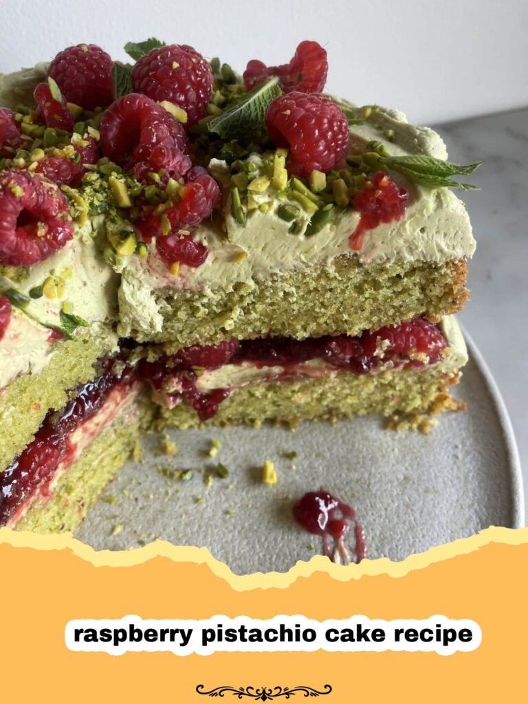 The Ultimate Raspberry Pistachio Cake Recipe: A Symphony of Flavors 5 A beautifully decorated two-layer raspberry pistachio cake with fresh raspberries and chopped pistachios on top.