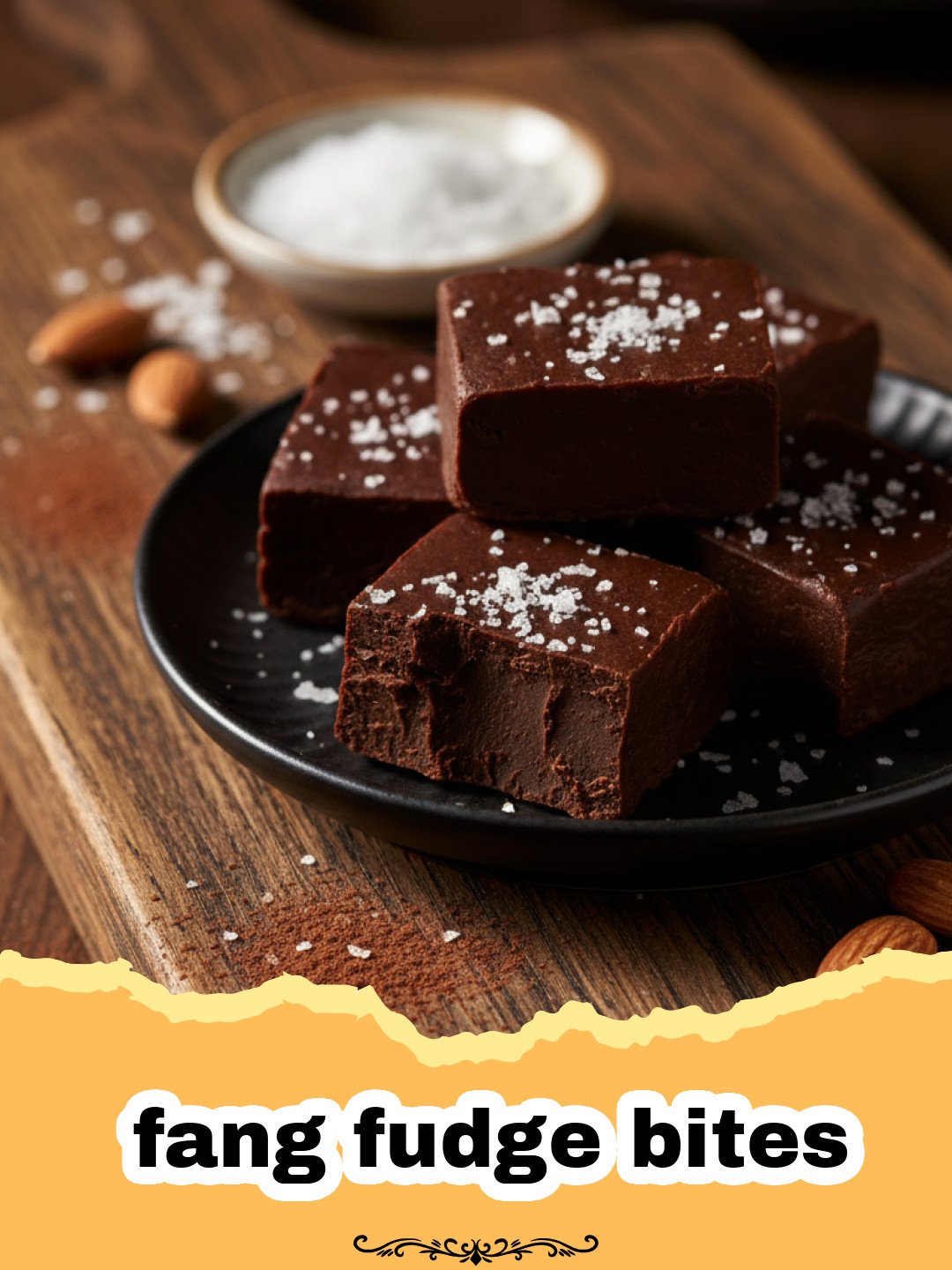 The Ultimate Fang Fudge Bites for Your Spooky Celebration 3 A platter of dark chocolate fang fudge bites with white chocolate vampire teeth decorations.
