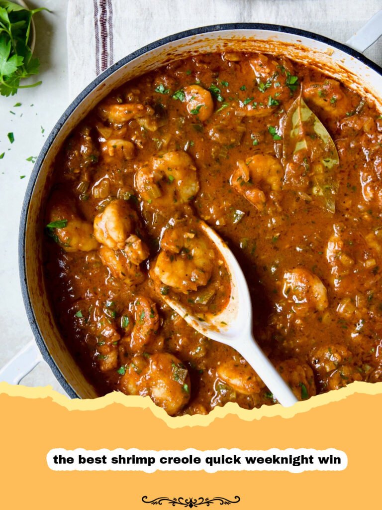A vibrant bowl of quick shrimp creole served over white rice, garnished with fresh parsley.