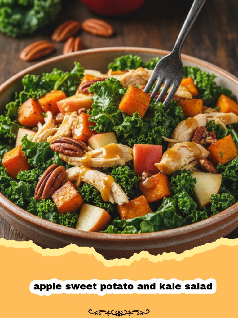 The Ultimate Apple Sweet Potato and Kale Salad 5 A large bowl filled with a colorful apple sweet potato and kale salad featuring orange potatoes and red apples.