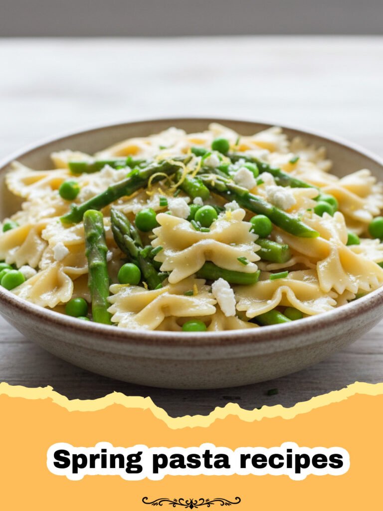 Creamy Lemon Asparagus Pasta: A Celebration of Spring 5 Spring pasta recipes - A white bowl filled with creamy lemon pasta, bright green asparagus, and peas, garnished with herbs.