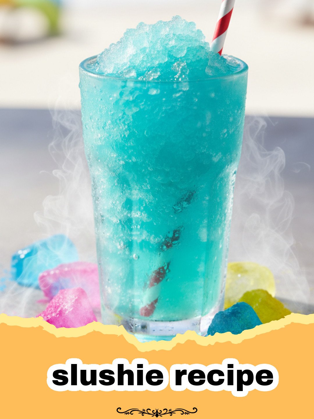 slushie recipe - Close-up of a vibrant red watermelon slushie in a glass with a lime wedge and straw