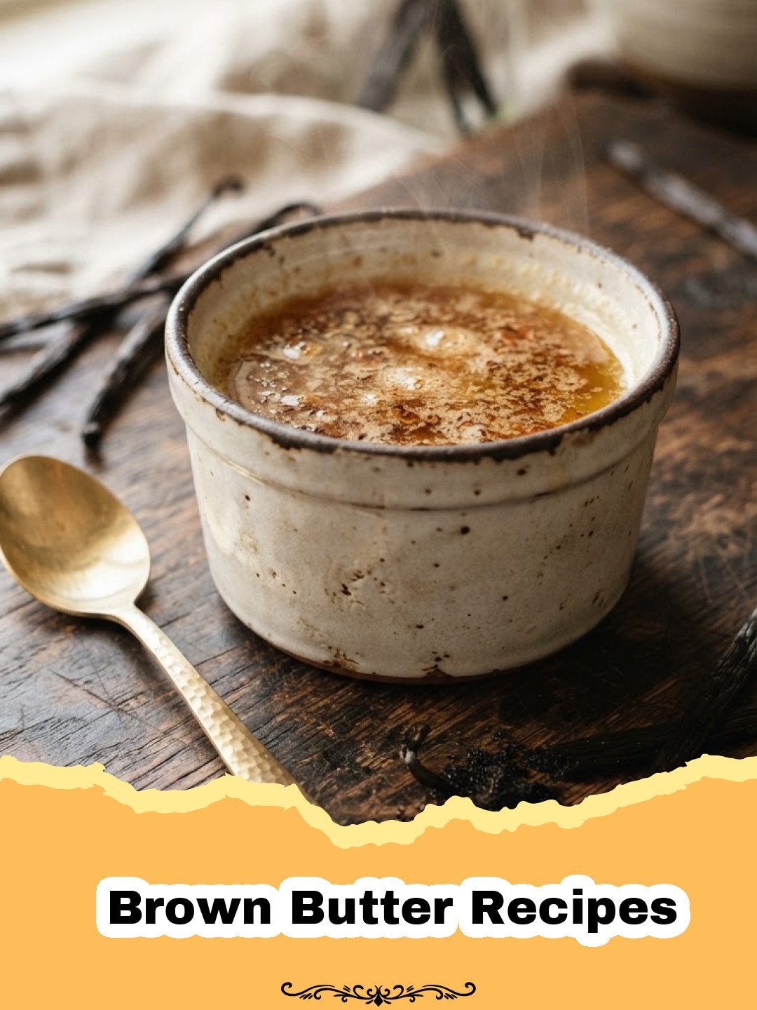 Brown Butter Recipes - Golden brown butter in a glass bowl, with a small saucepan in the background, showcasing its rich, nutty color and texture.