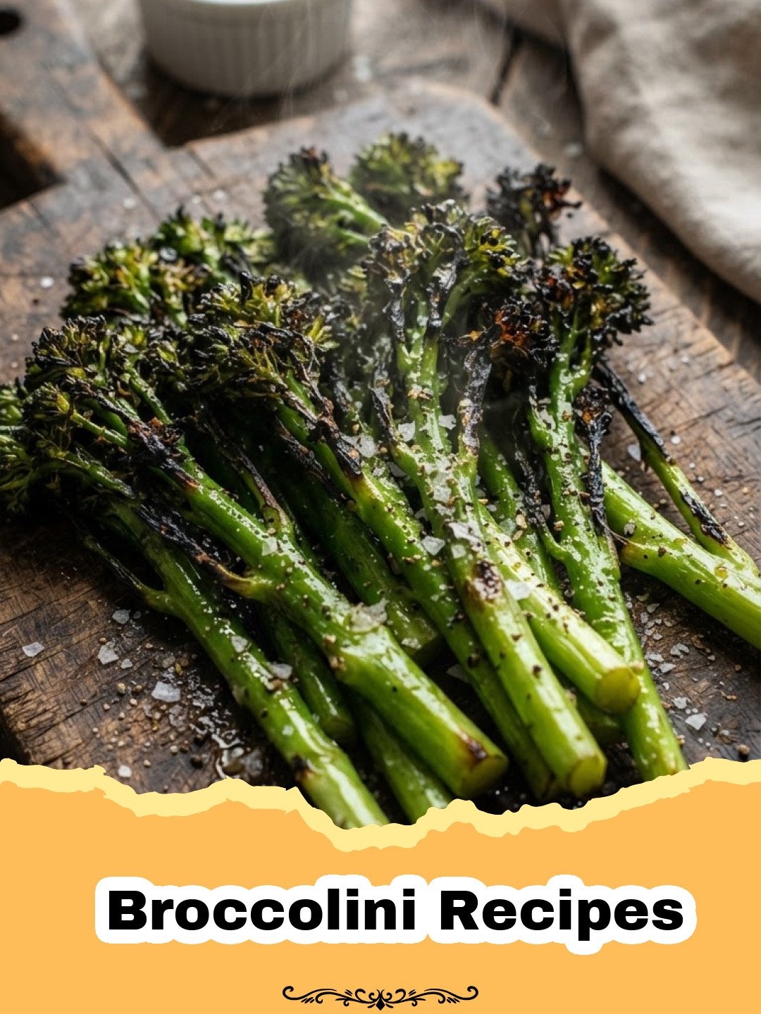 Roasted Garlic Parmesan Broccolini: The Easiest & Most Flavorful Side Dish 3 Broccolini Recipes - Close-up of perfectly roasted garlic parmesan broccolini on a white plate, garnished with lemon wedges.