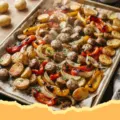Chicken Sausage, Apples & Potatoes Sheet Pan Dinner - Close-up of a sheet pan dinner with roasted chicken sausage, apple wedges, and potato chunks, perfectly caramelized.