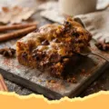 Fudgy Brown Butter Pumpkin Blondies - Close-up of fudgy brown butter pumpkin blondies cut into squares, showing their dense, moist texture and warm autumn color.