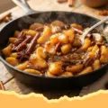 10-Minute Warm Cinnamon Maple Sautéed Apples - Close-up of warm cinnamon maple sautéed apples in a skillet, glistening with syrup.